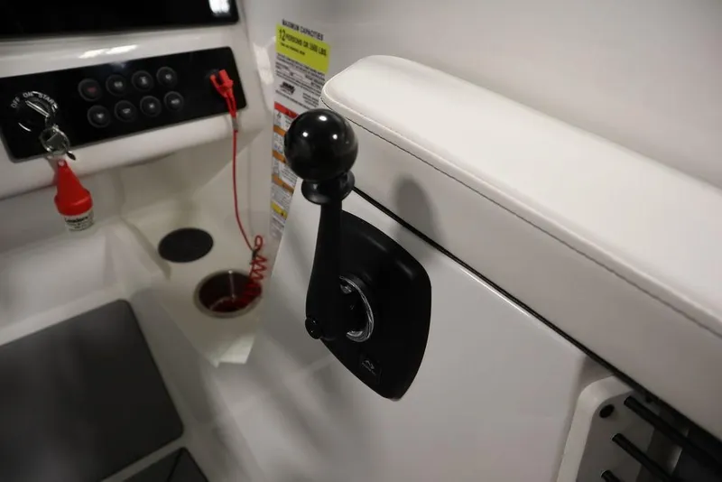 Slide: The Image of 2024 Heyday H20 boat control panel with throttle lever and safety features. - 25