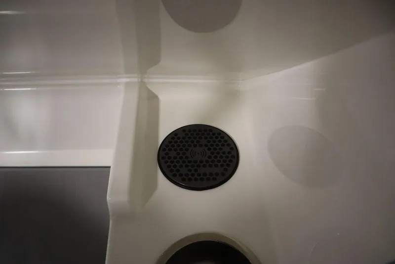 Slide: The Image of 2024 Heyday H20 boat interior with a black circular speaker on a white surface. - 26