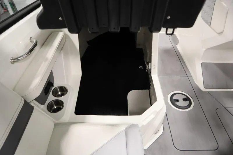 Slide: The Image of 2024 Heyday H20 boat interior with seating, cup holders, and storage area. - 37