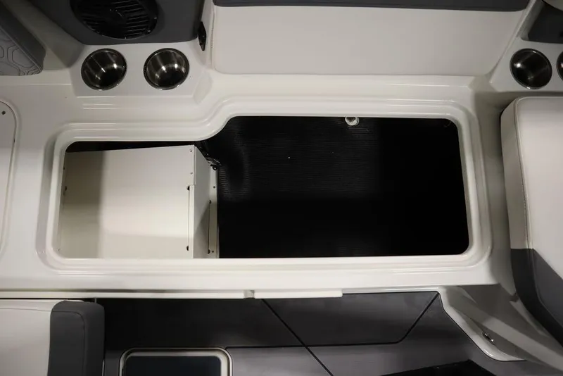 Slide: The Image of 2024 Heyday H20 boat interior storage compartment with cup holders and seating. - 43