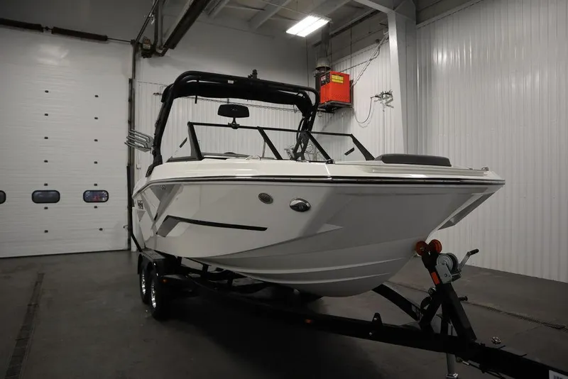 Slide: The Image of 2024 Heyday H20 boat on trailer in indoor storage facility. - 6
