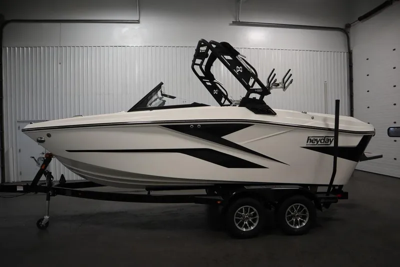 Slide: The Image of 2024 Heyday H20 boat on trailer in indoor setting, side view. - 9