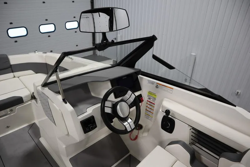 Slide: The Image of 2024 Heyday H20 boat interior with steering wheel and seating, showcasing modern design. - 19