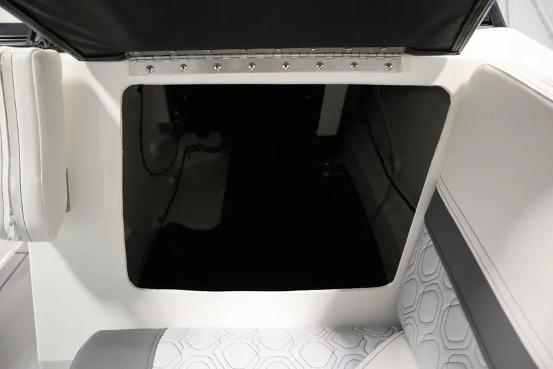 Slide: The Image of 2024 Heyday H20 boat interior storage compartment with cushioned seating. - 22