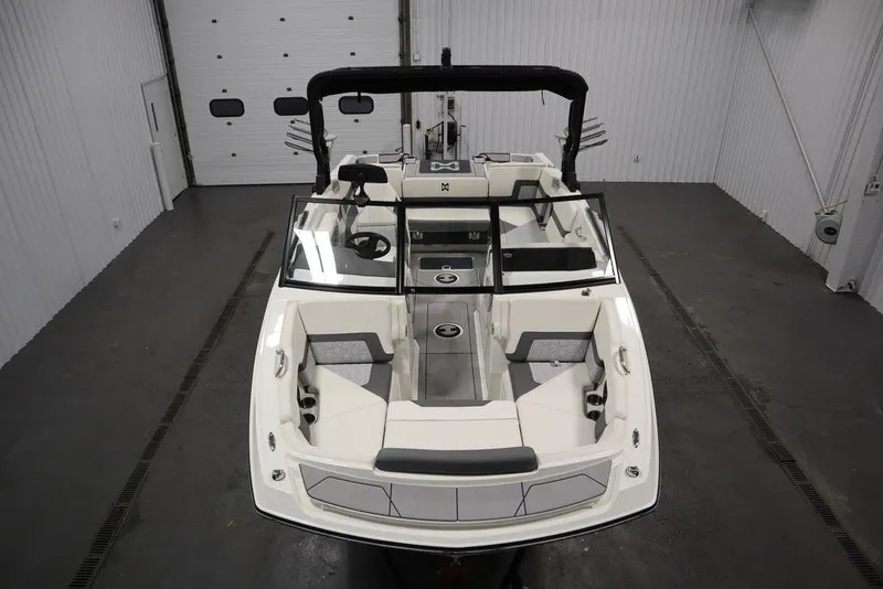 Slide: The Image of 2024 Heyday H20 boat interior, featuring sleek design and spacious seating in a showroom setting. - 8
