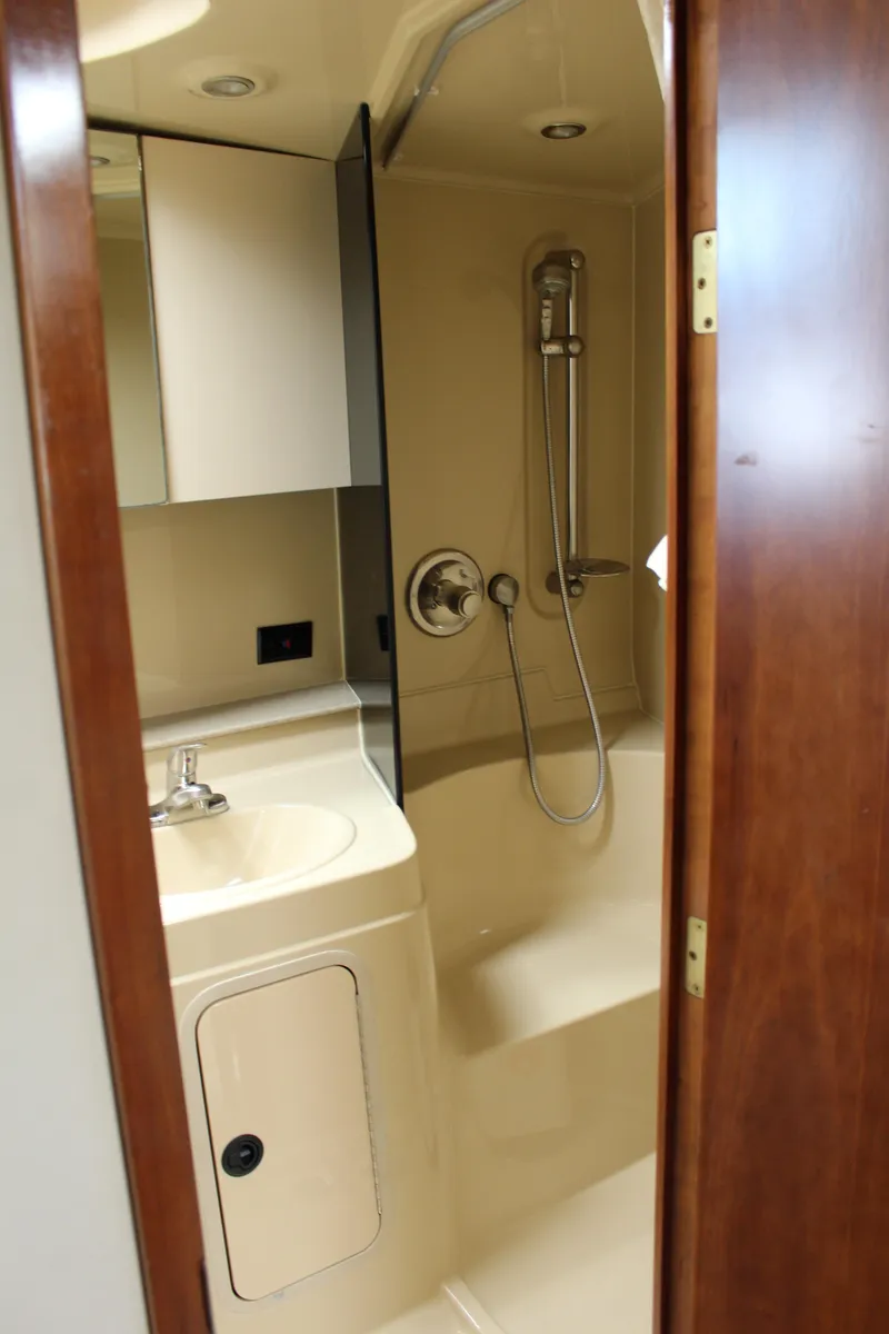 Slide: The Image of 2005 Cruisers Yachts 340 Express bathroom with shower and sink. - 16