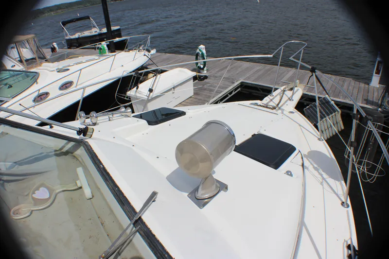 Slide: The Image of 1986 Carver 3297 Mariner docked at a marina. - 15