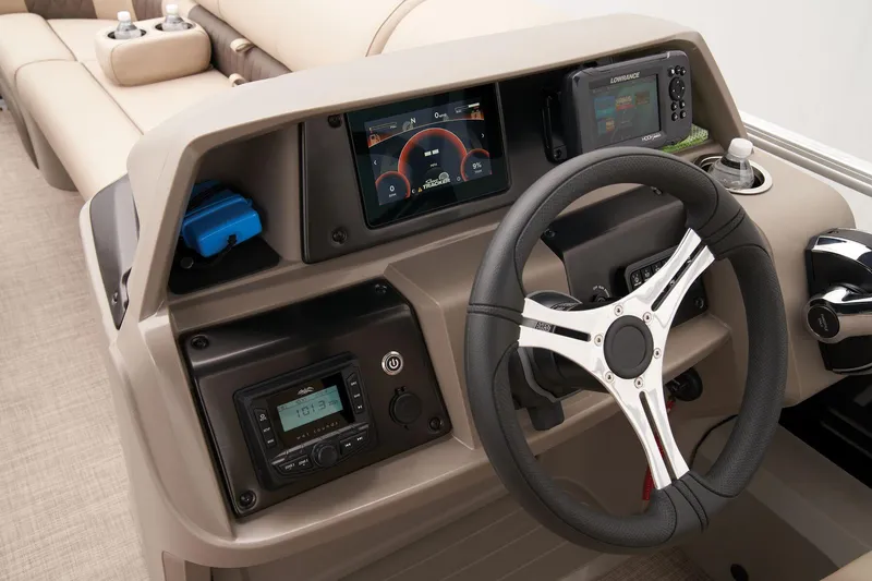 Slide: The Image of 2024 Sun Tracker SportFish 22 DLX helm with steering wheel and electronic displays. - 37