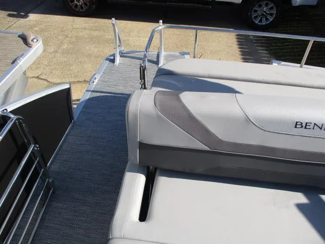 Slide: The Image of 2024 Bennington 22SXSB pontoon boat with gray seating and deck. - 4