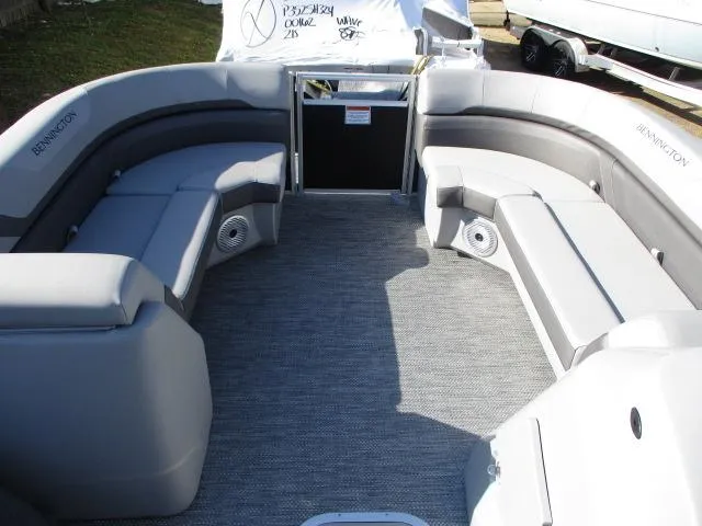 Slide: The Image of 2024 Bennington 22SXSB pontoon boat with spacious seating and modern design. - 5