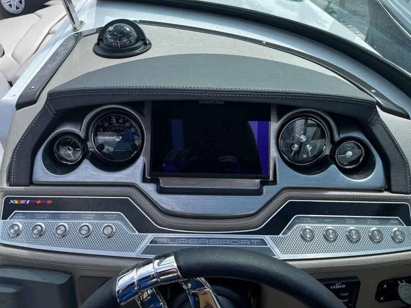 Slide: The Image of 2024 Monterey 275SS boat dashboard with gauges and controls. - 15
