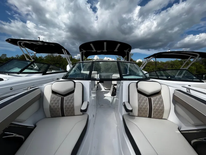 Slide: The Image of 2024 Monterey 275SS boat interior with luxurious seating and sleek design. - 19