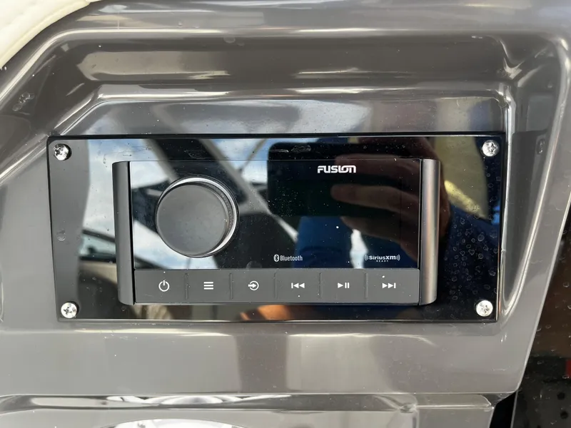 Slide: The Image of 2024 Monterey 275SS boat dashboard with Fusion Bluetooth stereo system. - 23