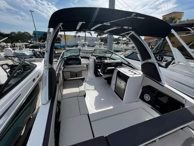 Slide: The Image of 2024 Monterey 275SS boat interior with seating and helm station. - 24