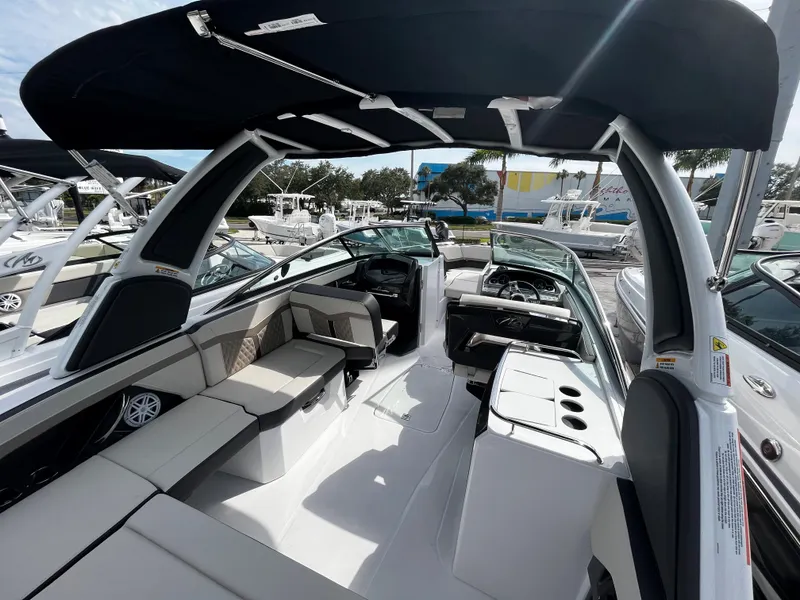 Slide: The Image of 2024 Monterey 275SS boat interior with seating and helm station. - 25