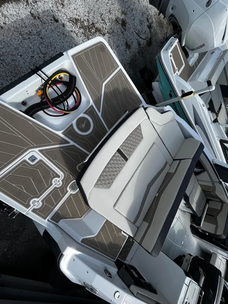 Slide: The Image of 2024 Monterey 275SS boat with spacious seating and modern deck design. - 7