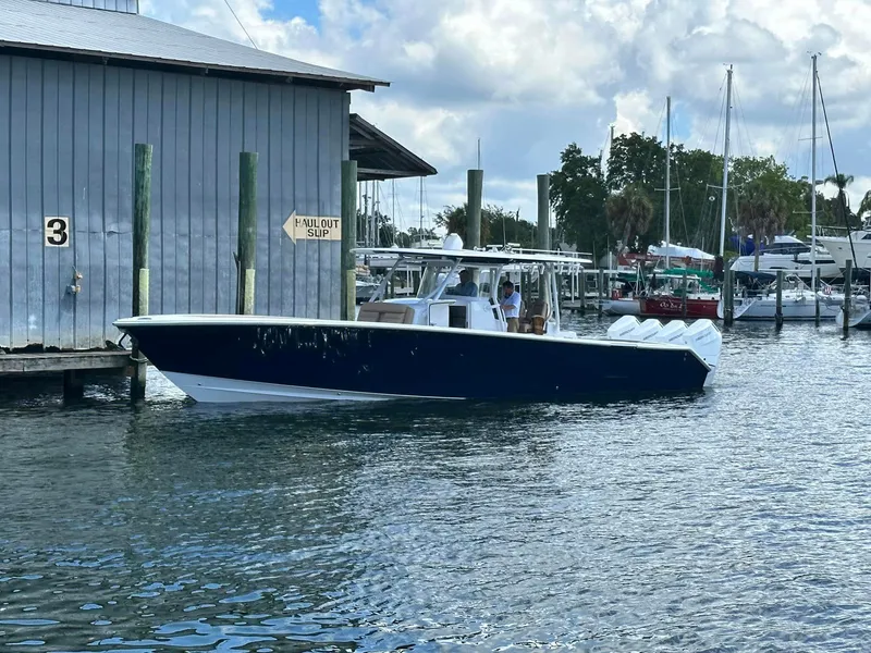 Slide: The Image of 2024 Jupiter 43 boat docked at a marina. - 0