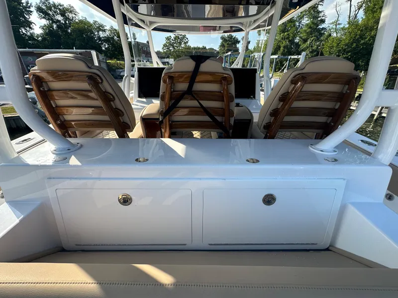 Slide: The Image of 2024 Jupiter 43 boat interior with seating and storage compartments. - 14