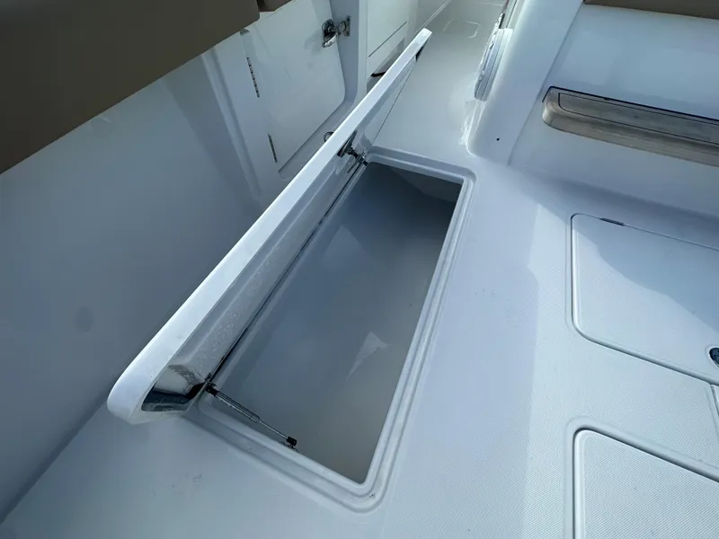 Slide: The Image of Open storage compartment on a 2024 Jupiter 43 boat. - 17