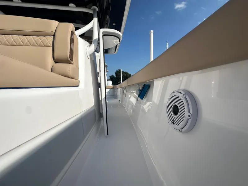 Slide: The Image of 2024 Jupiter 43 boat deck with beige seating and speaker. - 23