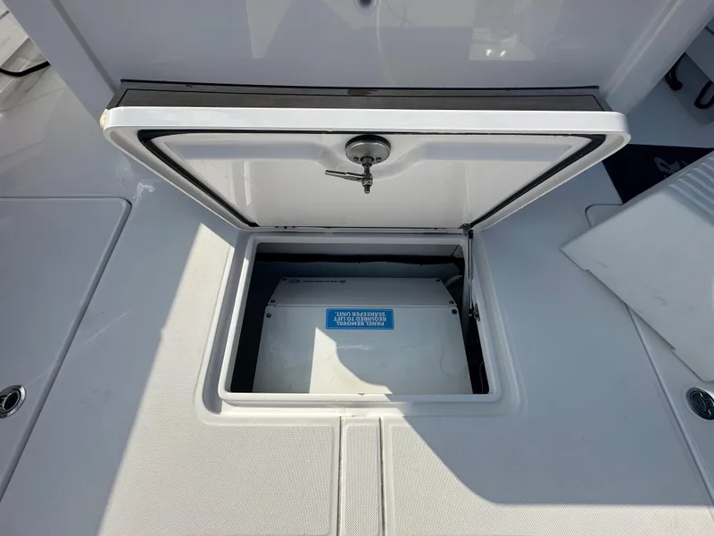 Slide: The Image of Open storage compartment on a 2024 Jupiter 43 boat. - 37