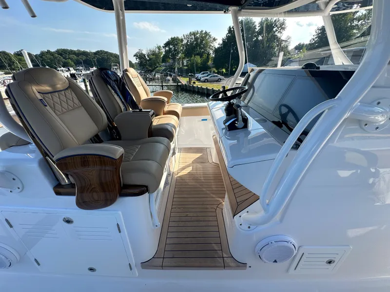 Slide: The Image of 2024 Jupiter 43 boat interior with luxurious seating and modern dashboard. - 41