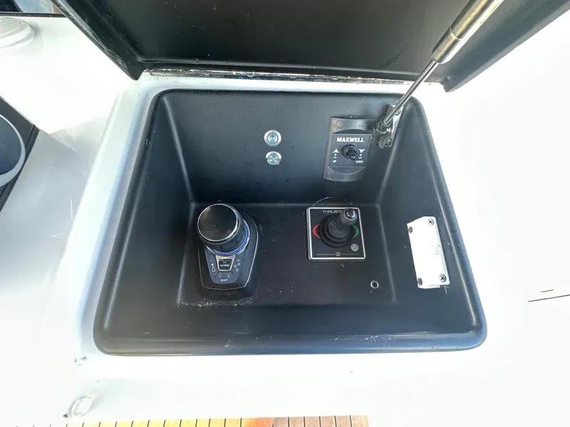 Slide: The Image of Control panel of 2024 Jupiter 43 boat with joystick and switches. - 45
