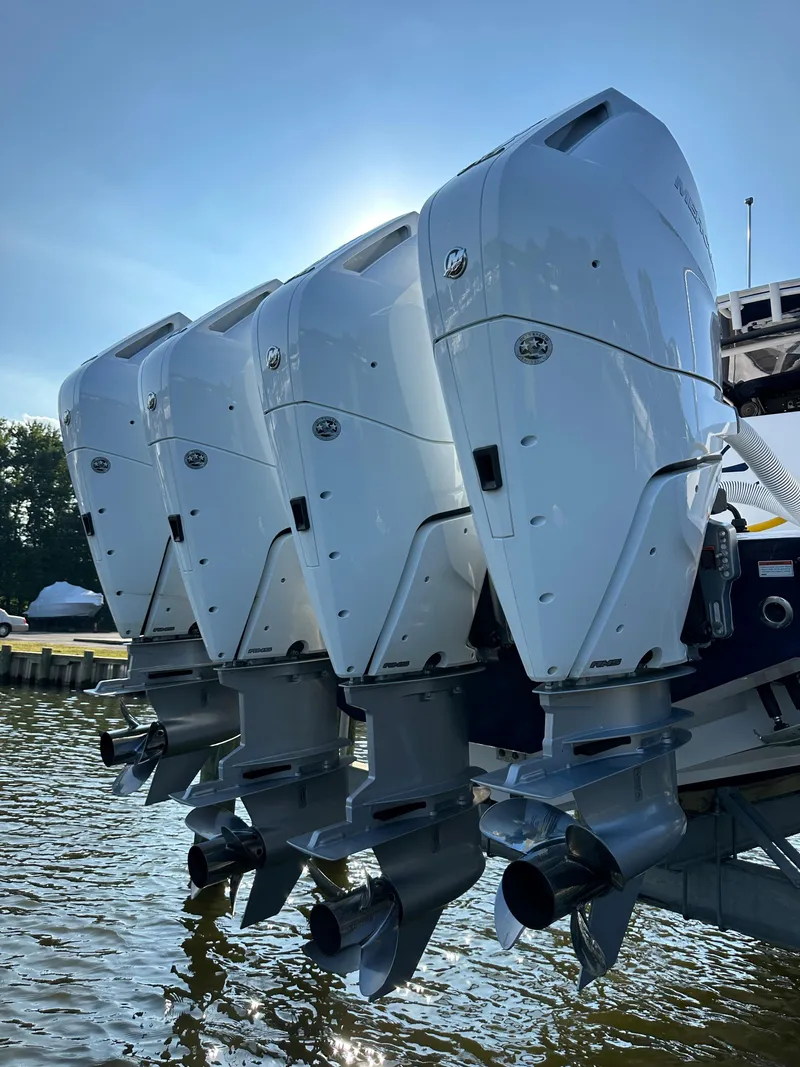 Slide: The Image of 2024 Jupiter 43 boat with four powerful outboard engines. - 5