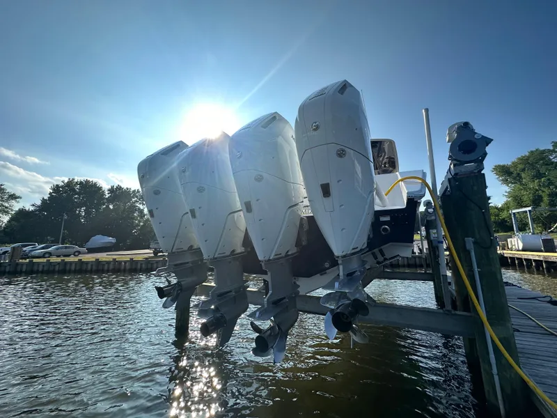 Slide: The Image of Jupiter 43 boat with quad outboard engines docked, 2024 model. - 6