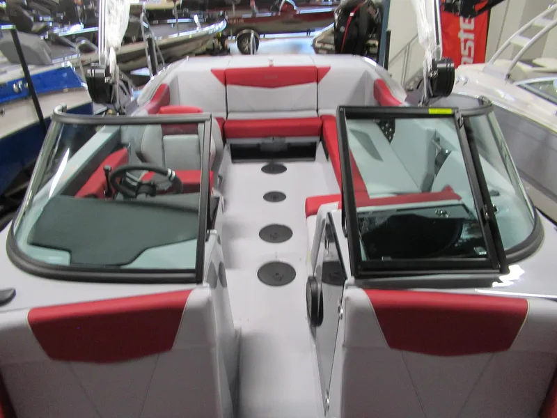 Slide: The Image of 2024 MasterCraft NXT 22 boat interior with red and gray seating. - 10