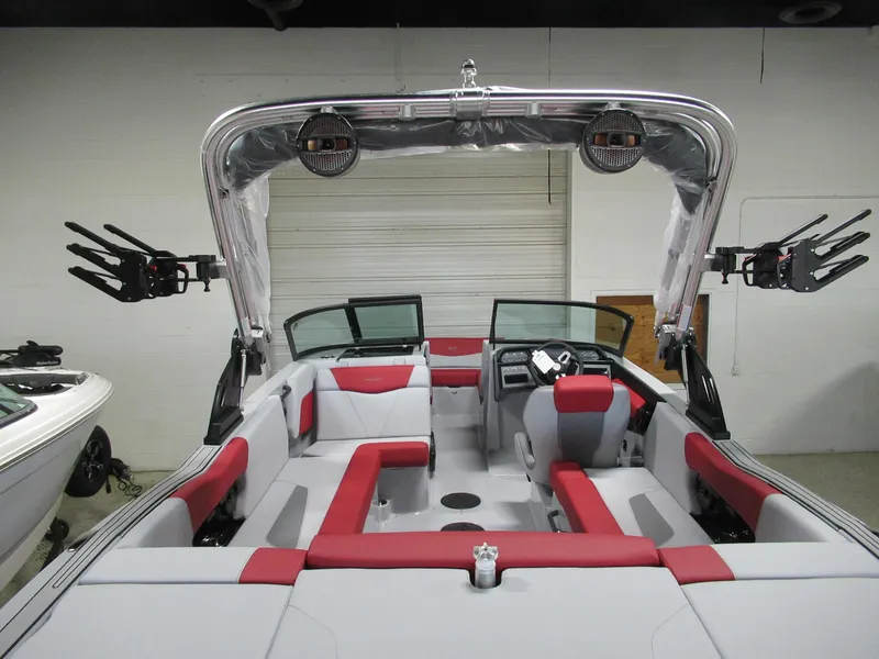 Slide: The Image of 2024 MasterCraft NXT 22 boat interior with red and gray seating. - 11