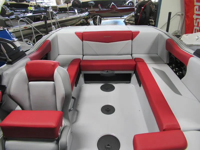 Slide: The Image of 2024 MasterCraft NXT 22 boat interior with red and gray seating. - 4