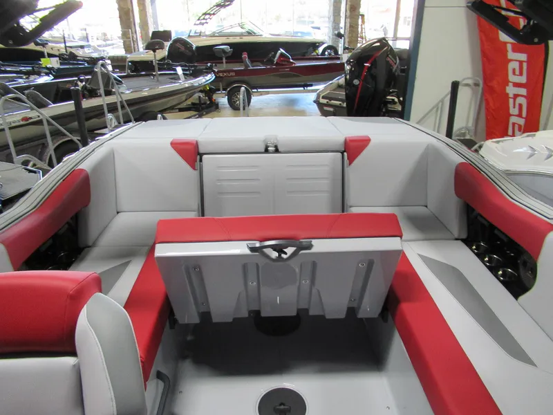Slide: The Image of 2024 MasterCraft NXT 22 boat interior with red and gray seating. - 5
