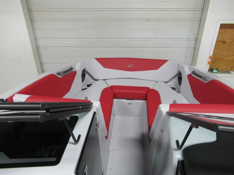 Slide: The Image of 2024 MasterCraft NXT 22 boat interior with red and white seating. - 9