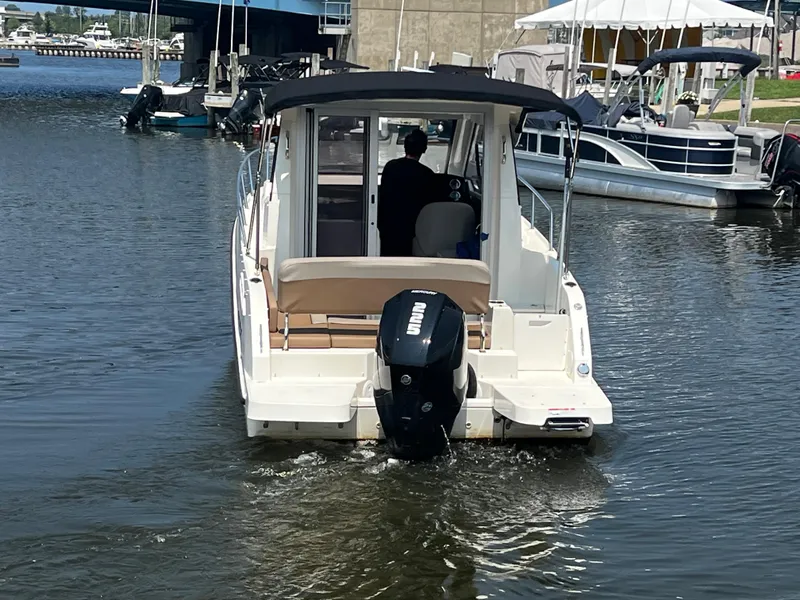 Slide: The Image of 2023 Quicksilver 675 Weekend Cruiser on water, rear view. - 14