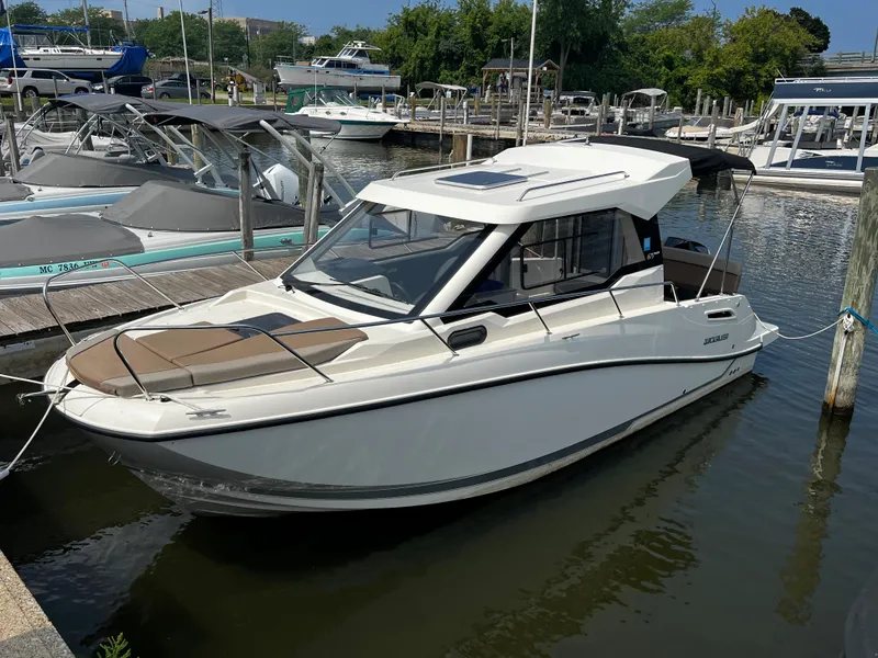 Slide: The Image of 2023 Quicksilver 675 Weekend Cruiser docked at a marina. - 15