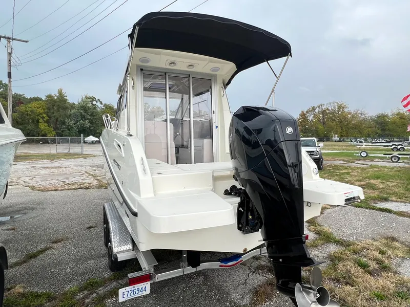 Slide: The Image of 2023 Quicksilver 675 Weekend Cruiser boat with outboard motor on trailer. - 18