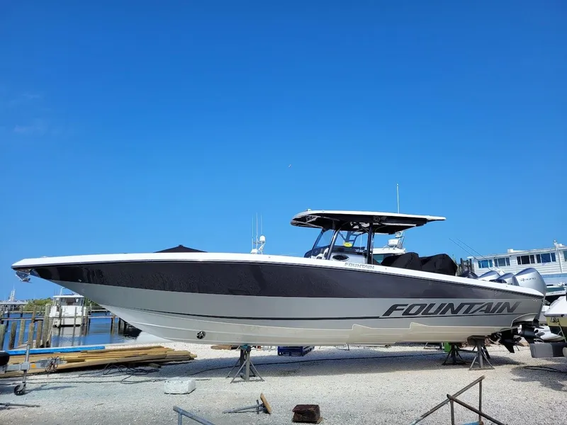Slide: The Image of 2025 Fountain 38 SC boat on dry dock under clear blue sky. - 1