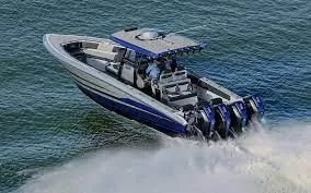 Slide: The Image of 2025 Fountain 38 SC boat speeding on water with four outboard engines. - 23