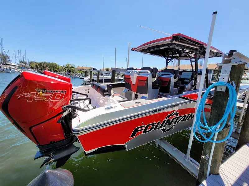 Slide: The Image of 2025 Fountain 38 SC boat docked, featuring a powerful 450R engine. - 24