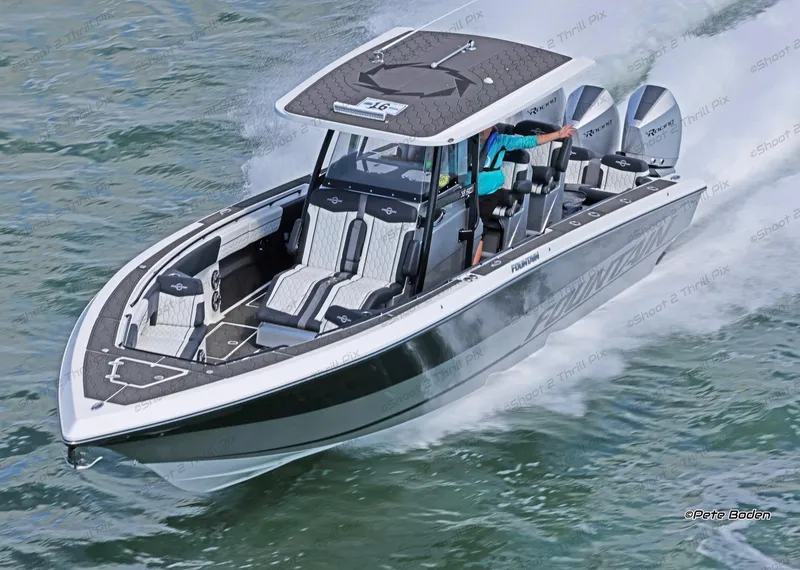 Slide: The Image of 2025 Fountain 38 SC boat speeding on water with triple outboard engines. - 5