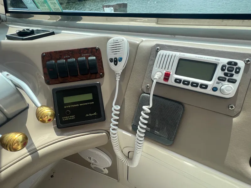 Slide: The Image of Control panel of a 2000 Sea Ray 540 Sundancer yacht with communication devices. - 11