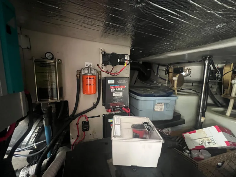 Slide: The Image of Engine room of a 2000 Sea Ray 540 Sundancer yacht with various equipment. - 21