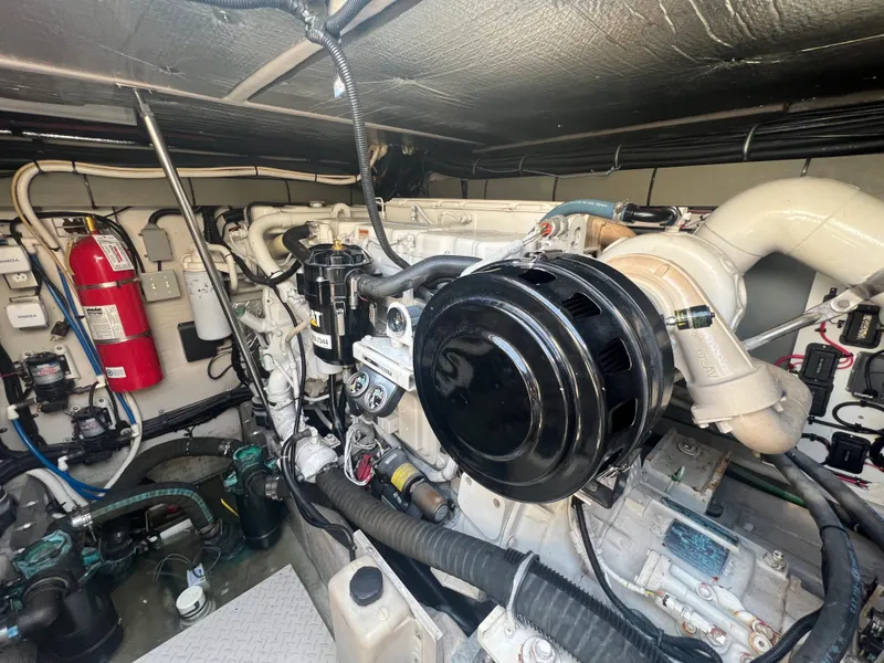 Slide: The Image of Engine room of a 2000 Sea Ray 540 Sundancer yacht with visible fire extinguisher. - 22
