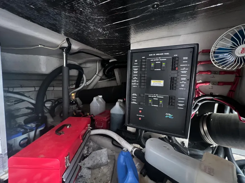 Slide: The Image of Engine room of a 2000 Sea Ray 540 Sundancer with control panel and toolbox. - 24