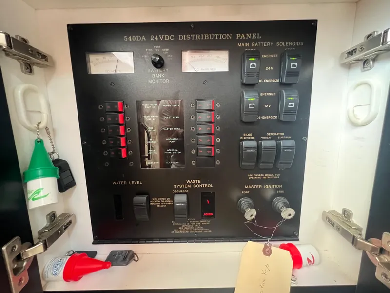Slide: The Image of Sea Ray 540 Sundancer 2000 24VDC distribution panel with gauges and switches. - 38