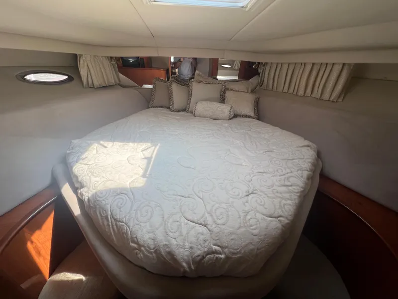Slide: The Image of Luxurious bedroom in 2000 Sea Ray 540 Sundancer yacht with plush bedding. - 40