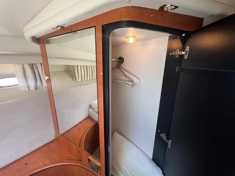 Slide: The Image of Interior cabin of 2000 Sea Ray 540 Sundancer with closet and mirror. - 42
