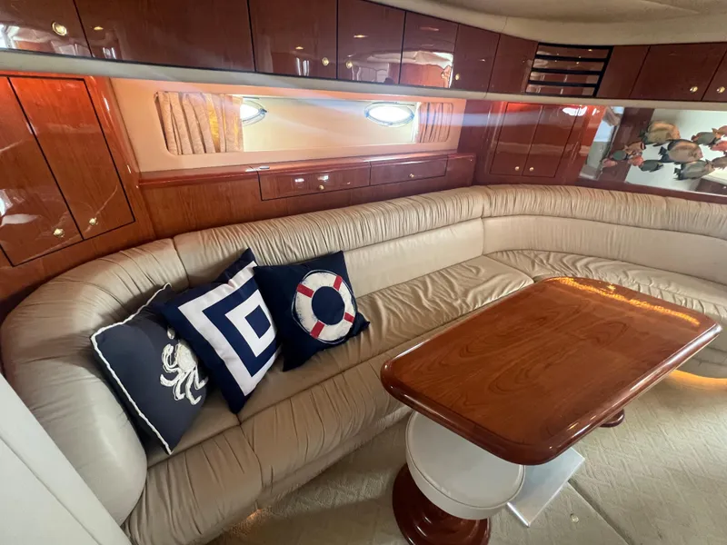 Slide: The Image of Luxurious interior of 2000 Sea Ray 540 Sundancer with plush seating and nautical-themed pillows. - 44