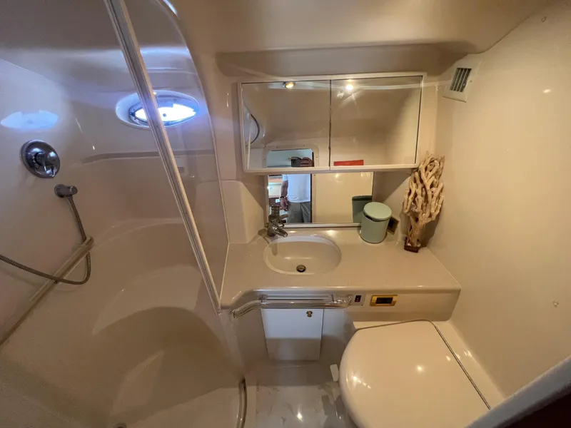 Slide: The Image of 2000 Sea Ray 540 Sundancer bathroom with shower, sink, and toilet. - 48